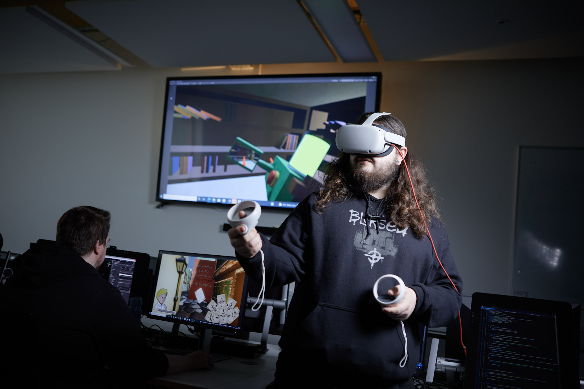 Photo shows students working with virtual reality software