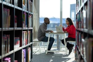 Two students have a meeting in the Learning Hub