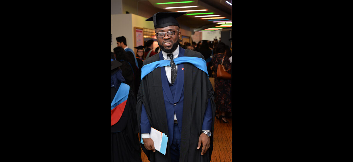 Mudiaga Akakabota, Law (Two-Year Accelerated) LLB student, on graduation day wearing mortarboard and gown