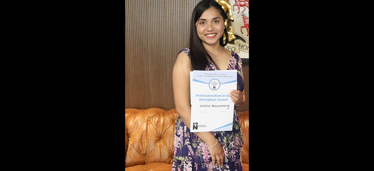 Drishtee Bhouvnessuree Bhowaneesing, Law LLB (Hons) student and placement student. Holding award that reads 'Professionalism in the Workplace Award'