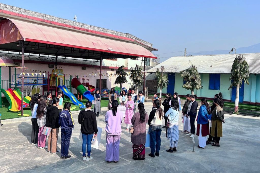 Young women in Nepal stand in a circle facing each other learning how to express themselves with confidence.