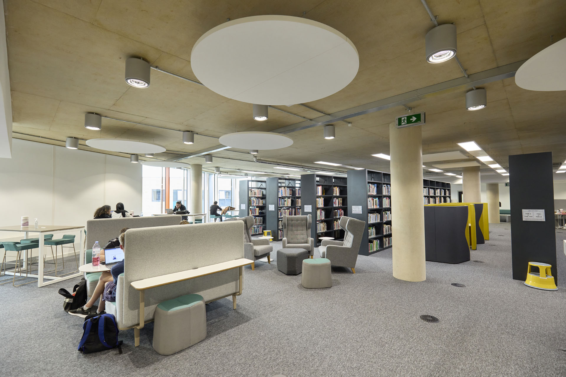 Internal view of seating and book stacks inside the Learning Hub