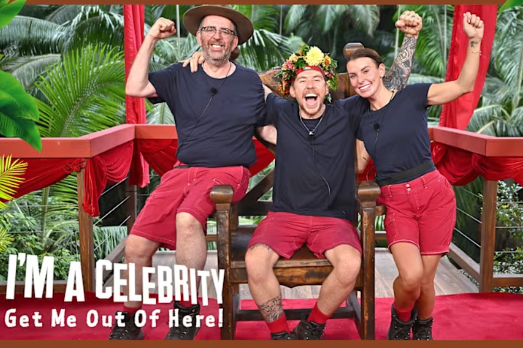 Three finalists from I'm A Celeb smile and cheer to camera.