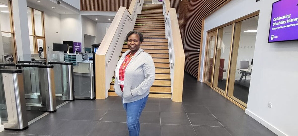 Anisat Adejoke Ogunrinade, standing in front of the main stairs in Senate